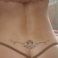 Lotus lower back tattoo