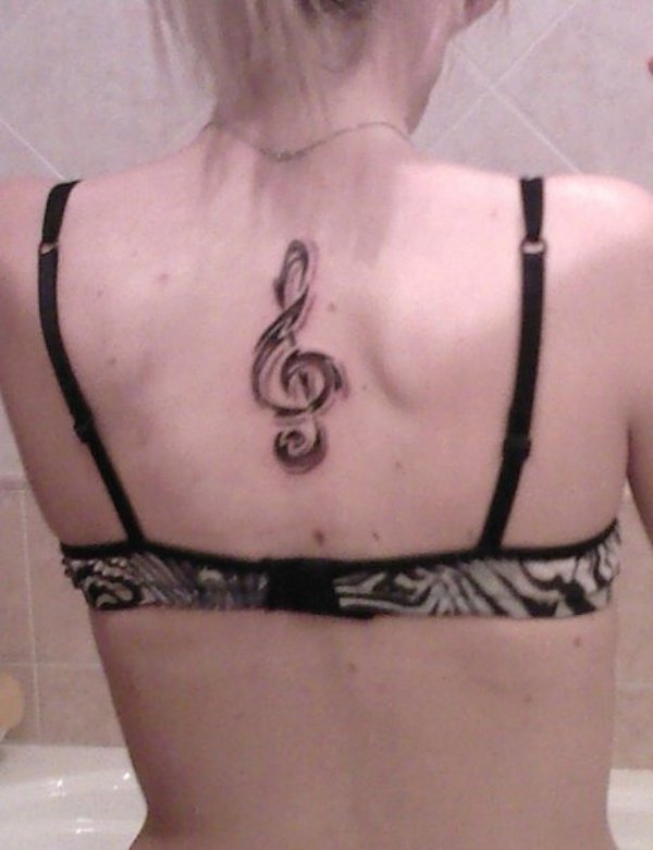 Alessandra - Tribal music tattoo