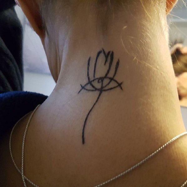 Barbara - Minimal lotus tattoo