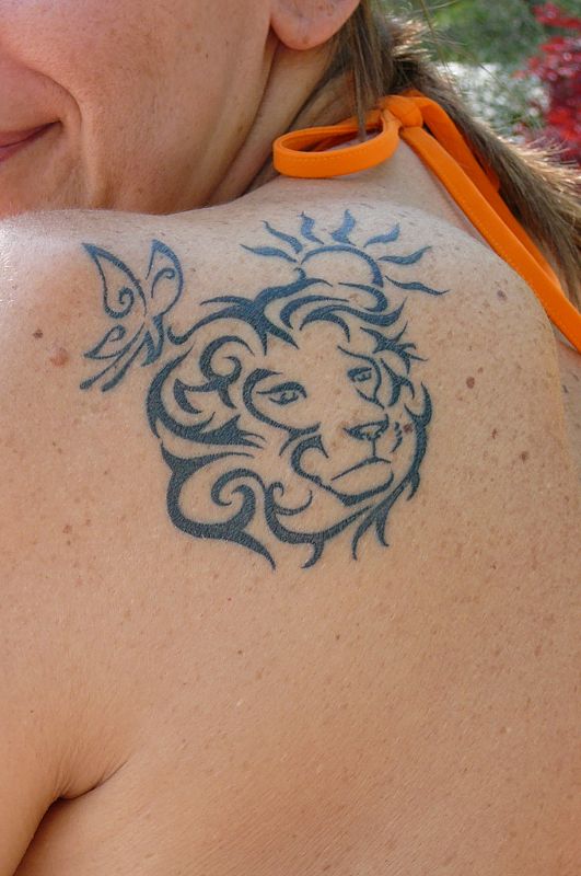 Gabriella - Lion, butterfly, sun tattoo photo