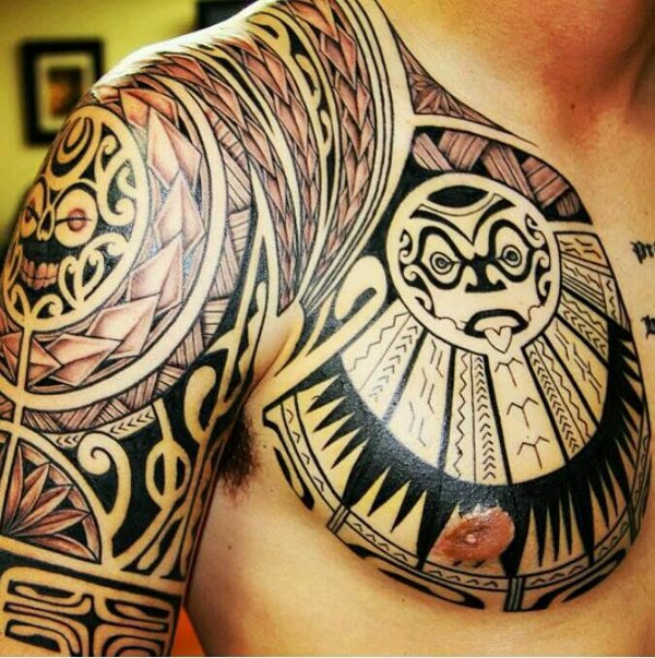 Guest - Polynesian chest and arm tattoo photo