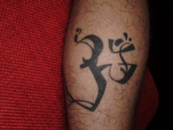 Manuel - Tribal Aum tattoo photo