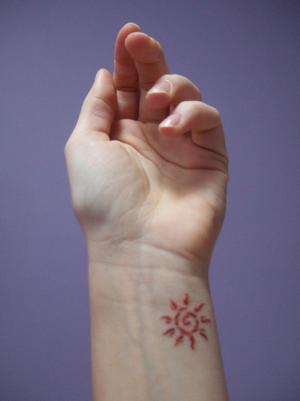 Neringa - Fire sun tattoo photo