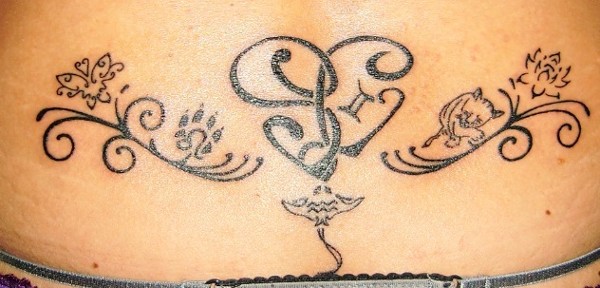 Sara - SL heart lowerback tattoo