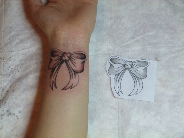 Stefania - Bow tattoo photo